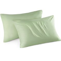 two light green pillows sitting next to each other