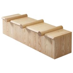 three pieces of wood sitting on top of each other