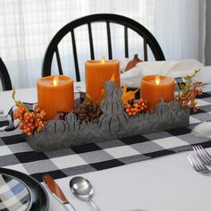 the table is set with candles and place settings