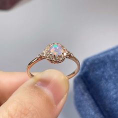 >>>> BASIC OPAL INFORMATION <<<< Round Opal : 5*5mm.Main stone: Natural good fire opal.Side stone: dainty cz diamond (cubic zircon).Material: 925 Sterling Silver +Natural opal stone.Metal color: silver, gold, rose gold. Metal materials: 925 sterling silver, 18K rose gold Plated, 18K rose gold Plated.>>>> SIMPLE DESIGN AND GOOD FIRE <<<>>> CUSTOM METALS <<<< Ring Size: From US #2 to US #15.Supply customized Solid Gold (9K, 14K and Formal Opal Ring With Cubic Zirconia, Diamond White Round Opal Jewelry, Rose Gold Pink Opal Round Jewelry, Rose Gold Pink Opal Jewelry, Elegant Pink Opal Moonstone Ring, Elegant Round Pink Opal Jewelry, Rose Gold Pink Opal Jewelry For Wedding, Cubic Zirconia Opal Ring With Accent Stones For Promise, Opal Ring With Cubic Zirconia Accent Stones For Gift