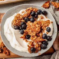 a bowl filled with yogurt and blueberries