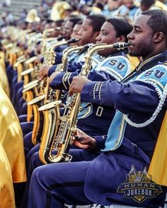 the marching band is playing their instruments