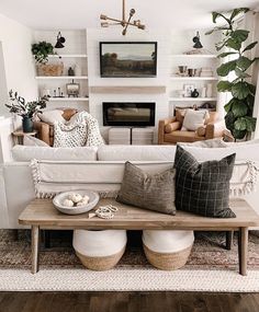 a living room filled with furniture and a fire place