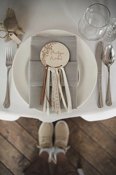 a place setting with silverware and napkins