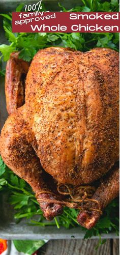 a roasted whole chicken on a tray with parsley and tomatoes in the back ground