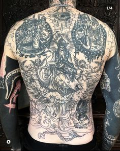 the back of a man with tattoos on his body