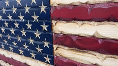 an american flag made out of wood with stars on the top and bottom, painted red white and blue