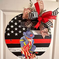 a patriotic door hanger with an image of a bear on it