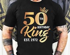 a man wearing a black shirt with the number fifty birthday king est 1932 printed on it