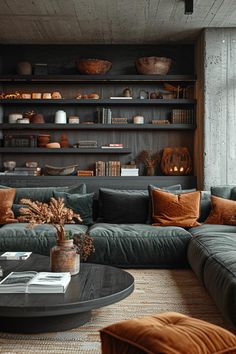 a living room filled with lots of furniture next to a wall mounted bookshelf