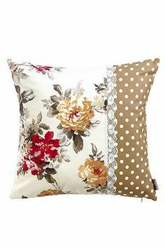 a pillow with flowers and polka dots on it