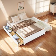 a bed sitting on top of a hard wood floor next to a wooden dresser under a window