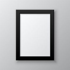 an empty black frame hanging on the wall