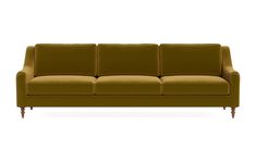 a brown couch sitting on top of a white floor