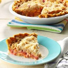 a slice of pie sitting on top of a blue plate next to a white bowl