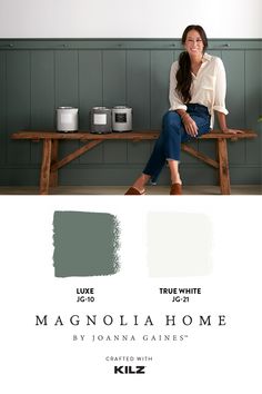 a woman sitting on a bench in front of a wall with gray paint colors and the words, true white magnolia home by joanna gales