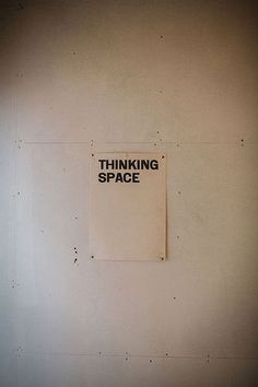 a sign on the wall that says thinking space