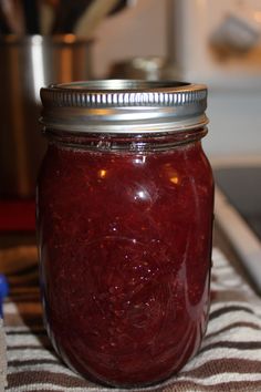 a jar filled with liquid sitting on top of a table