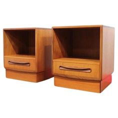 two wooden cabinets with drawers on each side