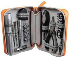 an open tool case filled with tools on top of a white surface and orange trimmings