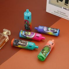 several different types of toothpaste on a brown table next to a package of matches