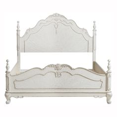 a white bed with an ornate headboard and foot board is shown against a white background