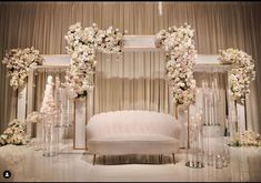 an elegant wedding setup with white flowers and candles