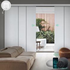 a living room filled with furniture next to a sliding glass door