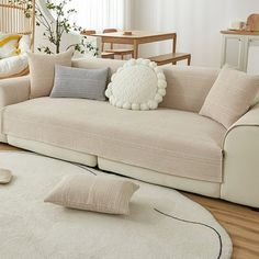 a living room filled with furniture and decor