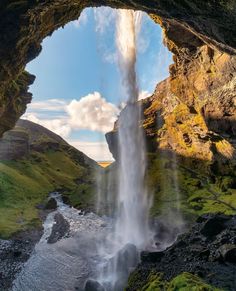 an image of a waterfall coming out of the ground