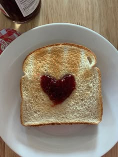 a piece of bread with jam on it sitting on a plate