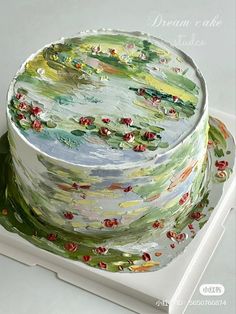 a cake decorated with water lilies and leaves