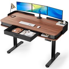 a computer desk with two monitors on it