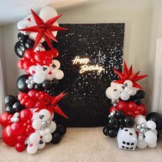 balloons are arranged in the shape of animals and dices for a new year's eve party