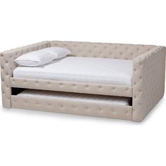 an upholstered daybed with a pillow on the top and bottom bed underneath it