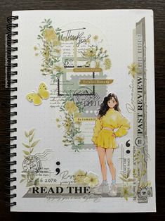 a notebook with an image of a woman in yellow dress and flowers on the cover