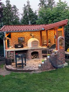 an outdoor kitchen is built into the side of a house