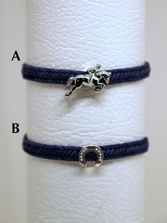 Elegant and precious horse-themed bracelet. The metallic part is a work of the sculptor Giuseppe Albano. Made with the lost wax casting system. Finished by hand and rhodium plated to increase brilliance. All metal parts are made of hypoallergenic metal. The lace is in sturdy nylon similar to jeans. The bracelet is available in 2 models (A-B) of your choice. Choice of size (adjustable with chain): woman (from 15 to 20 cm - 6-8 inc) or man (from 20 to 26 cm - 8-10 inc). The bracelet is sent in a canvas bag with a sculptor's label. A precious and unique object, also ideal as a gift. Copper Lace, Horses Theme, Horse Face, Wax Casting, Lost Wax Casting, Lost Wax, Charm Bracelets, Sculptor, Canvas Bag