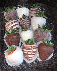 chocolate covered strawberries in a plastic container on a table