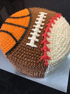 a cake decorated to look like a football and basketball ball