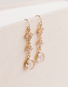 "✨Designed specifically for your special day, but can be worn on any occasion!✨ Beautifully accent any wedding dress or date night outfit with our Rainfall Earrings! Perfectly sparkly with just the right amount of class. These earrings are hypoallergenic and feature a 14k Gold Filled hook with Gold Plated cubic zirconia and vintage glass accents. Earrings measure approx. 1.6\" x .3\" Thank you so much for shopping with GGC! By supporting a small business, you are supporting a dream, a family, and so much more! We are so grateful for you! We hope to create with you again soon! ✨LOOKING FOR MORE EARRINGS?✨ Check out our other listings here: https://www.etsy.com/shop/GoldenGratitudeCol?ref=simple-shop-header-name&listing_id=1157209858§ion_id=37356619" Wedding Earrings Bride Gold, Wedding Dangle Cluster Earrings, Elegant Wedding Cluster Earrings With Ear Wire, Gold Teardrop Linear Earrings For Weddings, Delicate Round Bridal Earrings For Wedding, Round Bridal Earrings With Ear Wire, Delicate Bridal Earrings For Wedding, Elegant Crystal Ear Wire Earrings For Wedding, Delicate Gold Crystal Earrings For Wedding