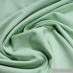 Roughened cotton jersey! Winter sweat! The price refers to 1 running metre (1.00 m length x 1.50 m width) of through-dyed, roughened cotton jersey in pastel green. Article description: Material: 100 % cotton Width: 150 cm; 1.64 yd Weight: 270 g / m²; 410 g / m Weave: single jersey Care instructions: washable up to 40o C, 1-iron point, tumble dry Characteristics: -opaque -stretchy -Oeko-Tex Standard 100 -warming -soft Use: -comfortable household and casual clothing -sweat shirts The pictures show Cotton Linen Fabric, Fabulous Fabrics, Fabric Stores Online, Pastel Green, Green Fabric, Green Cotton, Dressmaking, Beautiful Fabric, Cotton Linen