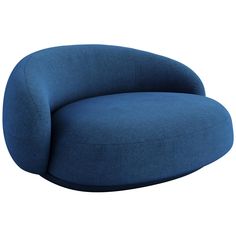 a large blue couch sitting on top of a white floor