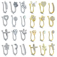 many different types of ear clips with crystal stones on each side and one has a heart shaped