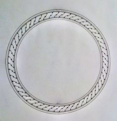 a drawing of a white circle with an intricate design in the middle, on a plain surface