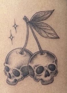 two skulls with leaves on their backs