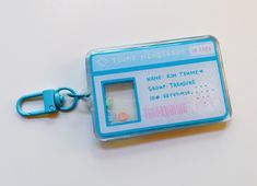 a plastic keychain with an id card attached to it's clipping