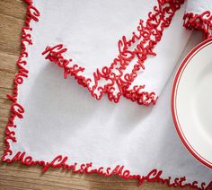 a red and white placemat with the word love spelled on it