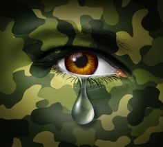 a woman's face painted in camouflage with a tear coming out of her eye