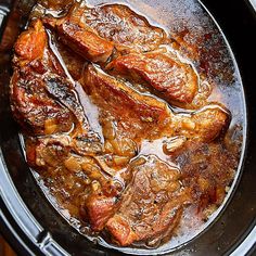 the meat is being cooked in the slow cooker